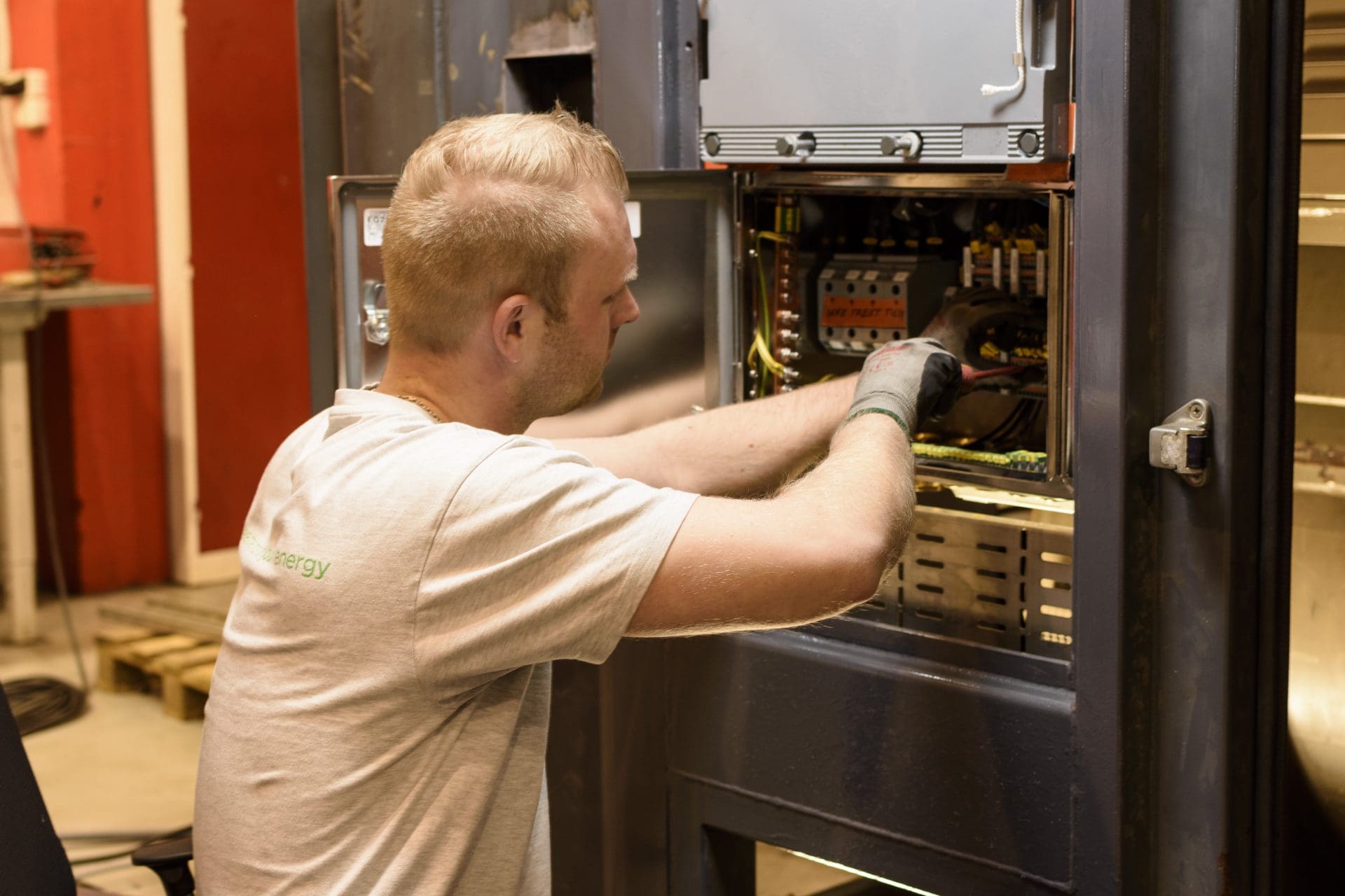 man instaling electric equipment