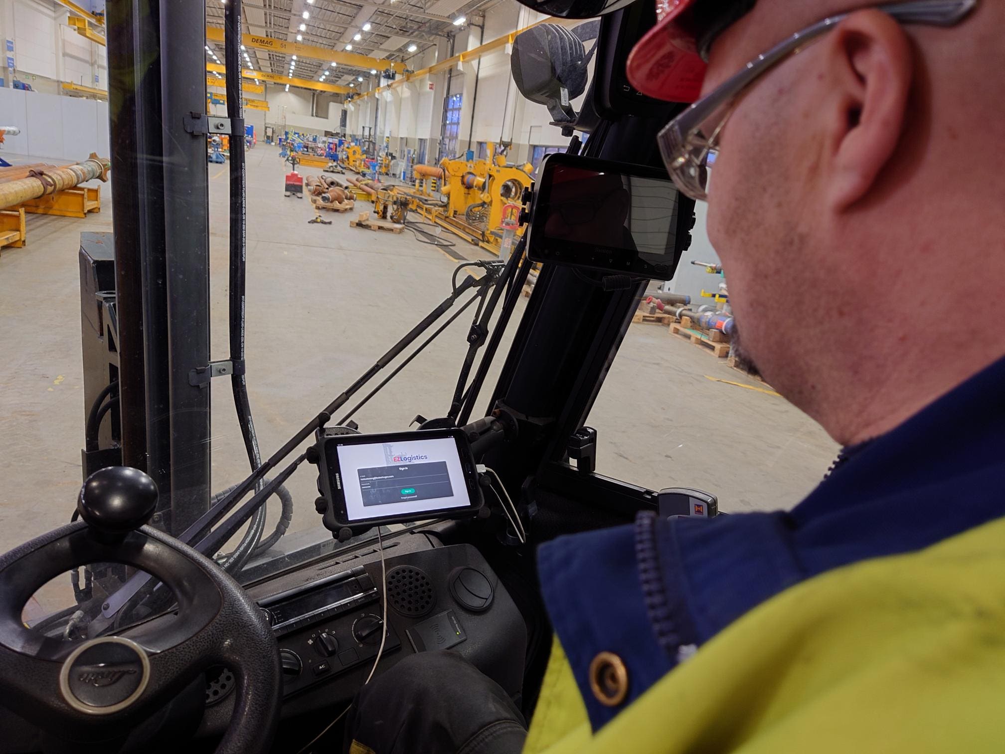 workshop worker holding phone